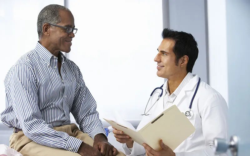 a doctor is consulting a black man for ZSR Circumcision